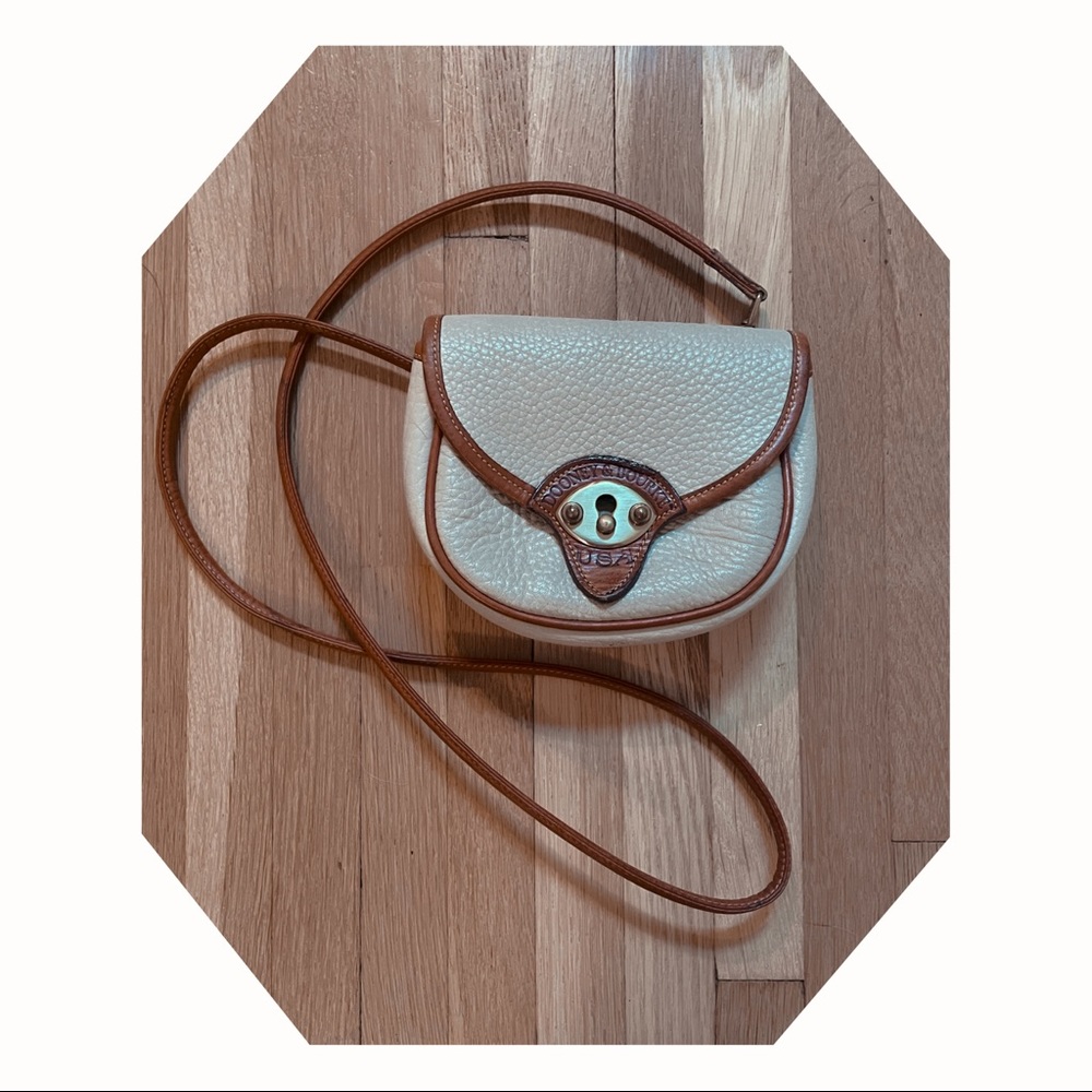 Dooney and bourke cream/tan cavalry all weather leather mini belt bag cross body